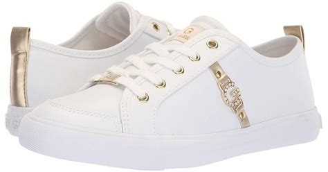 guess white sneakers with gold.